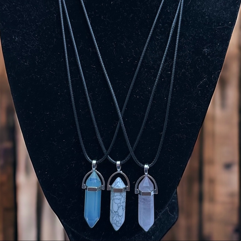 3 crystal pendant necklaces, blue, white and pink.